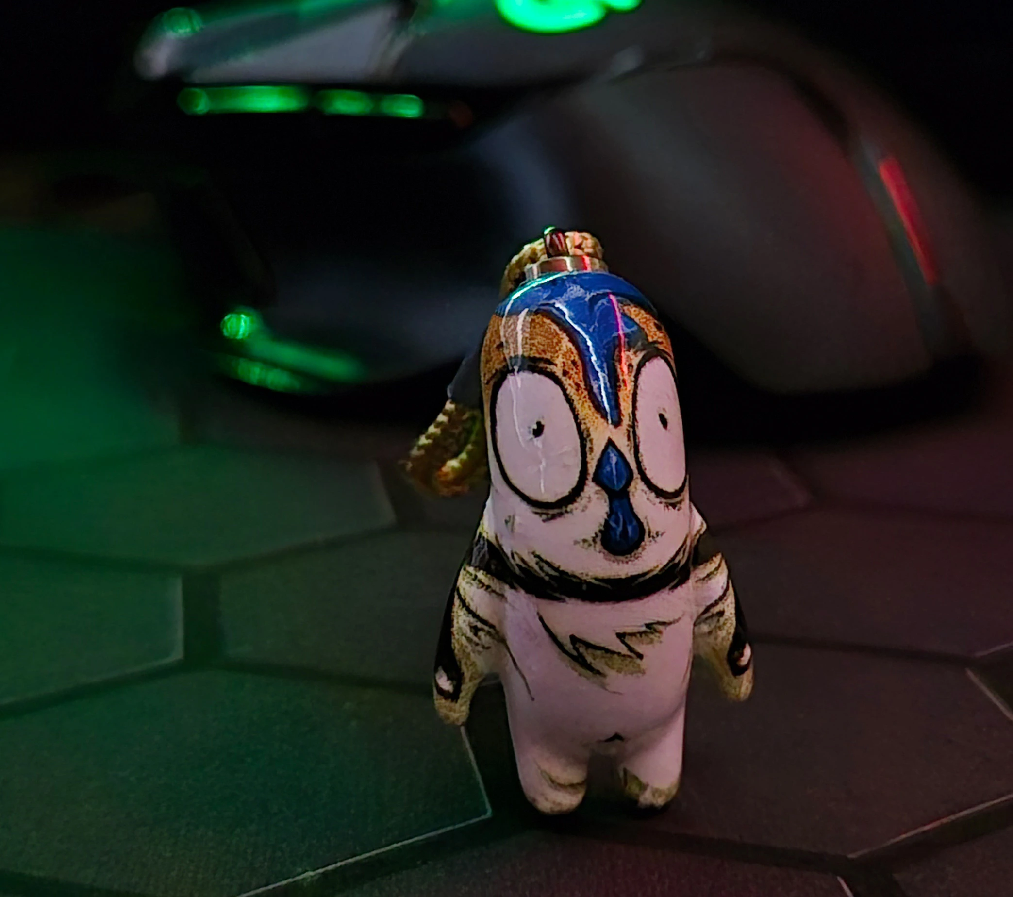 Handmade chicken charm on a desk